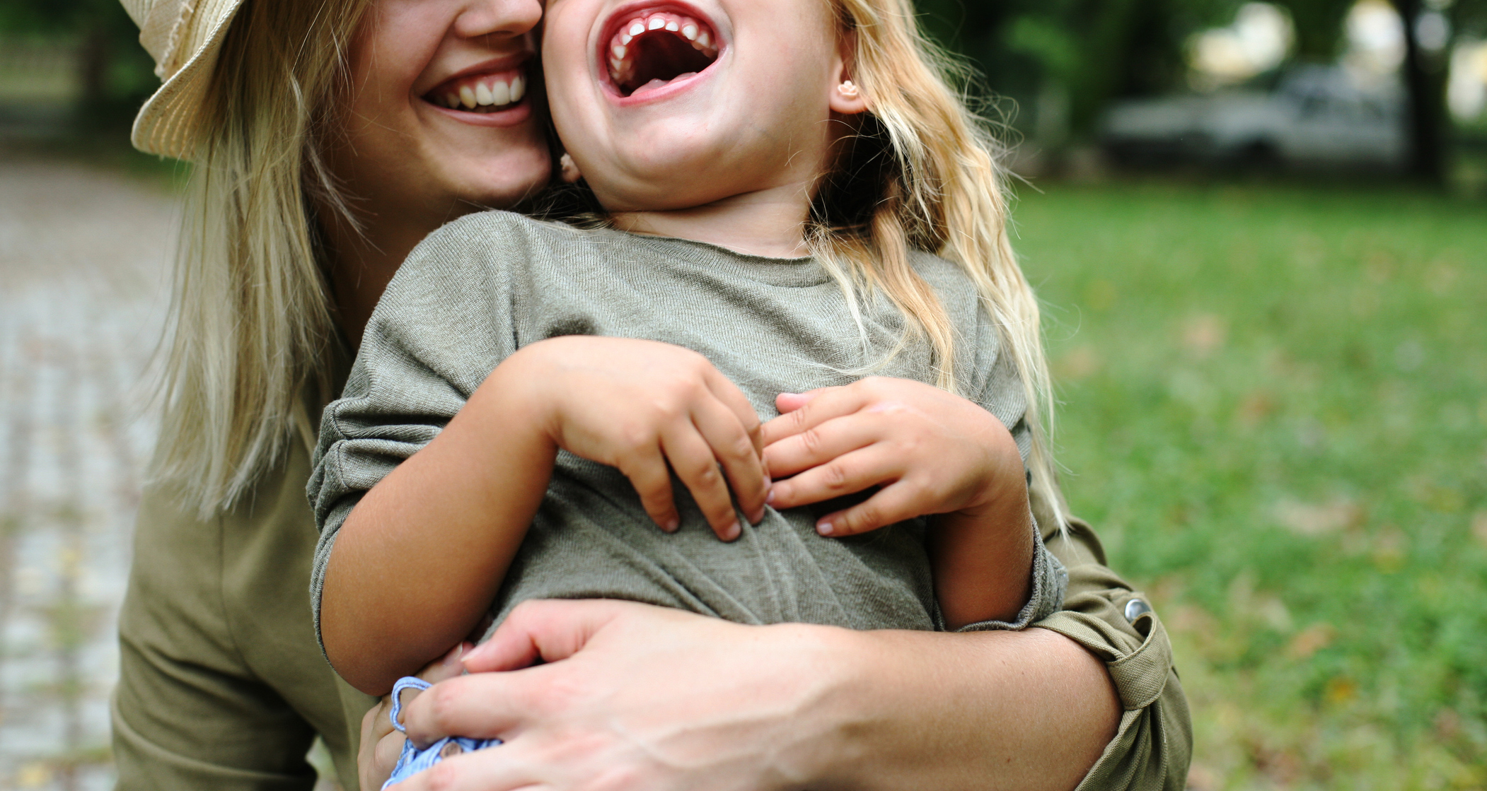 Cheerful mother with her daughter outdoor.