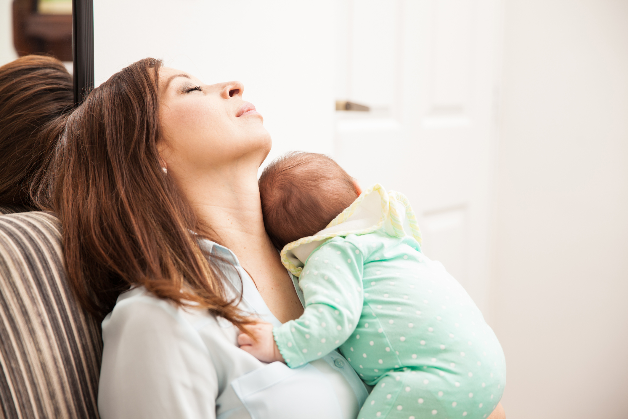 Mom falling asleep with her baby