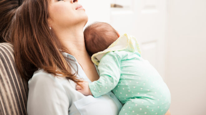 Mom falling asleep with her baby