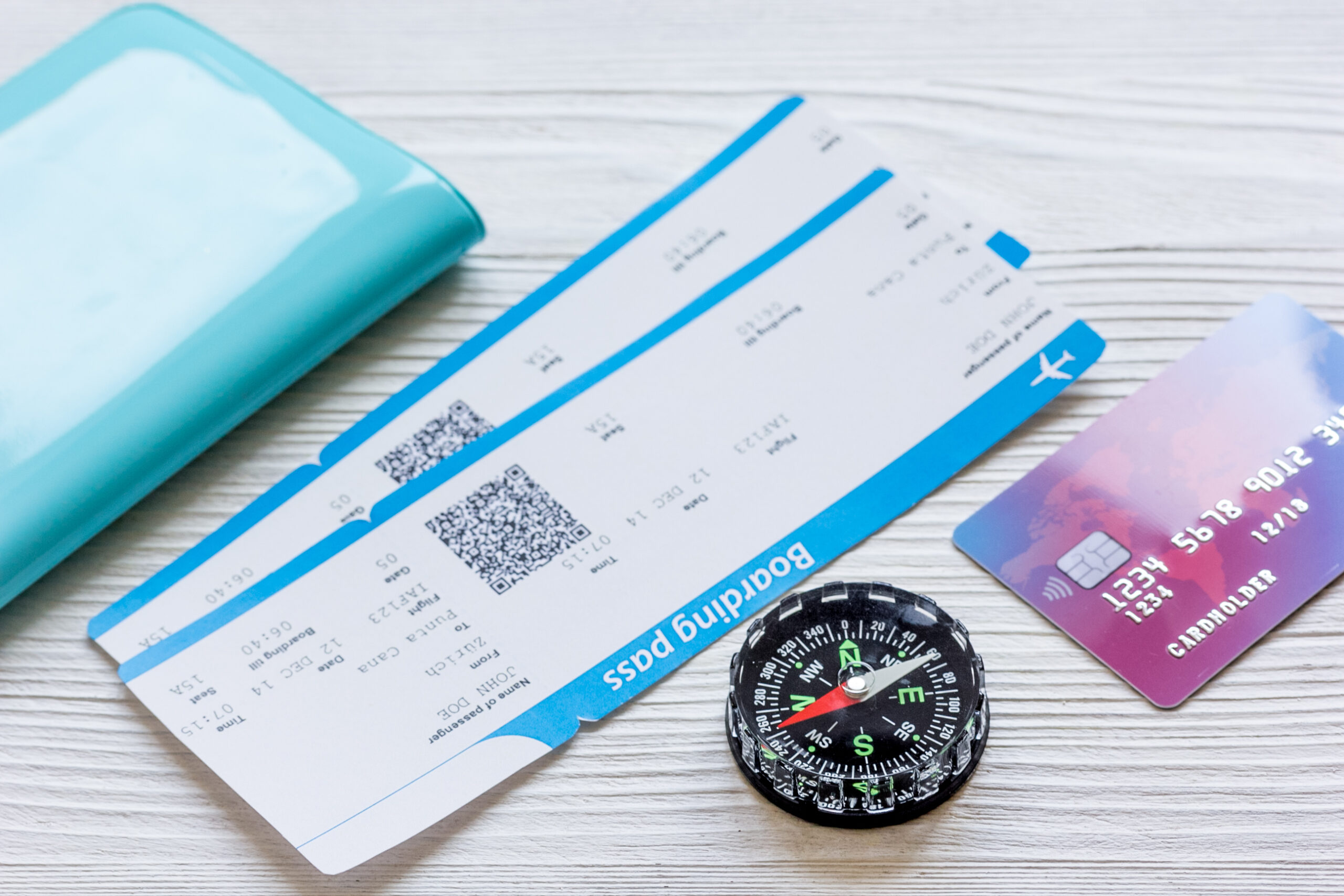 passport, credit card, tickets on wooden background