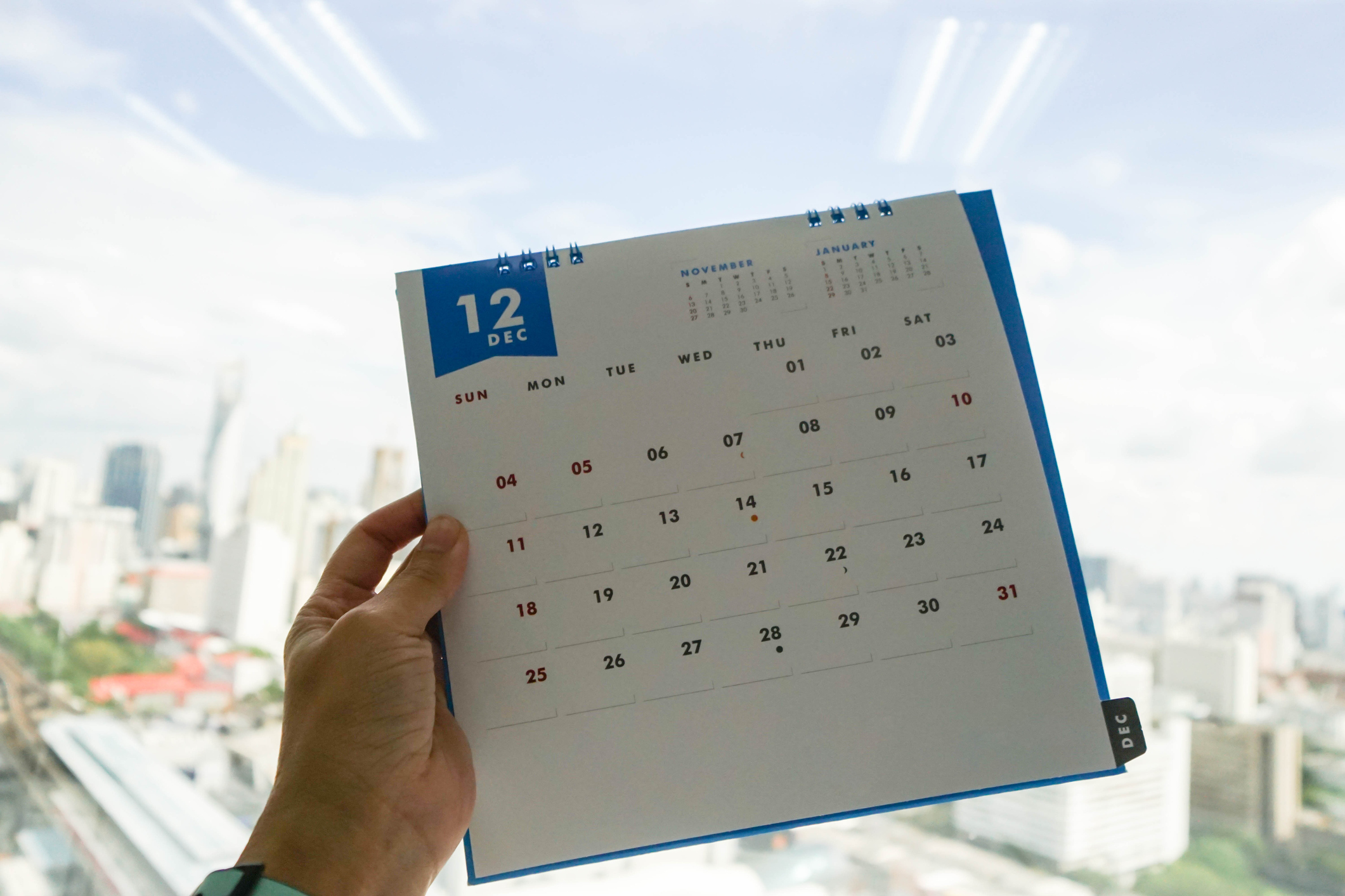 woman hold December calendar in left hand