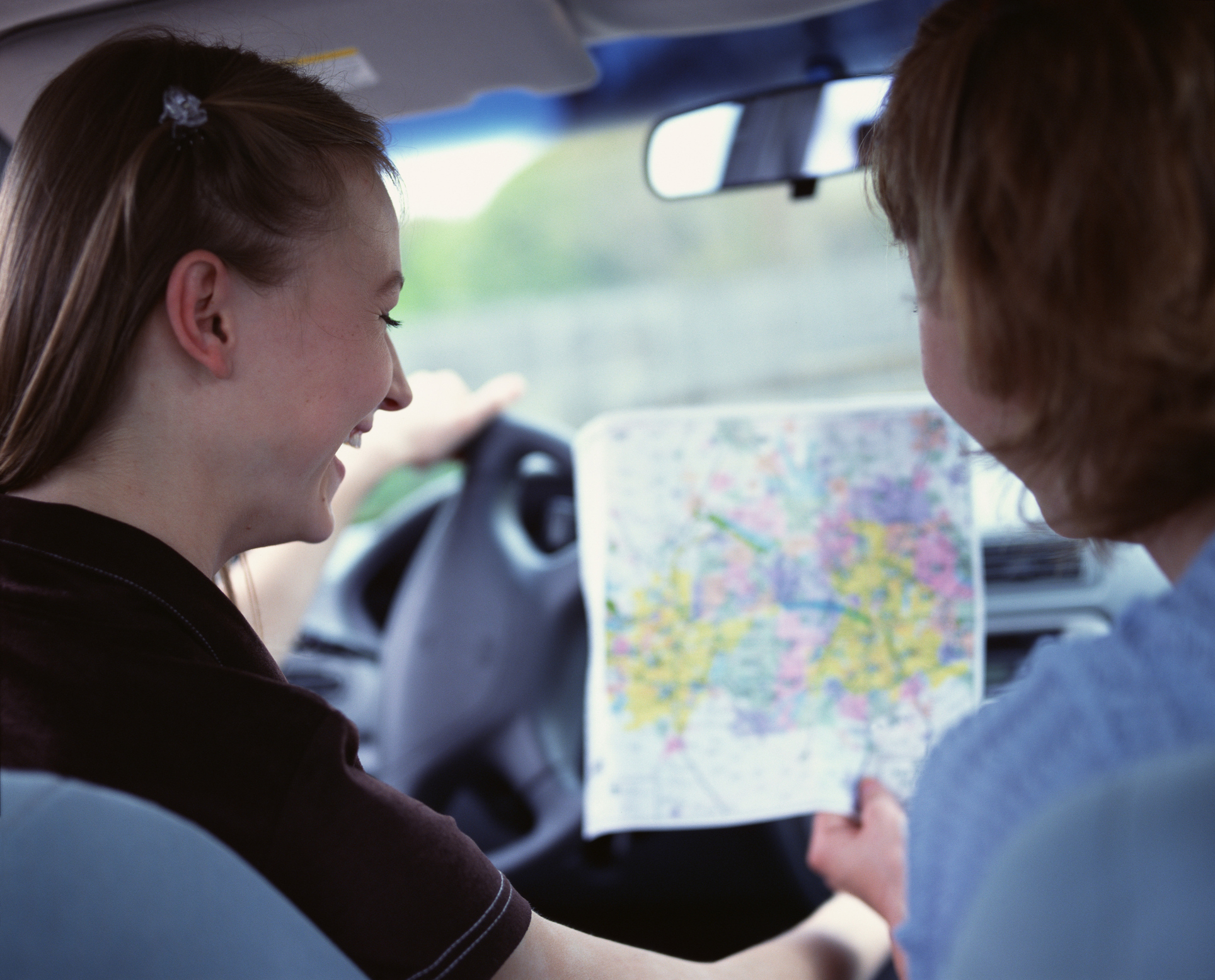 Looking at a car map Looking at a car map