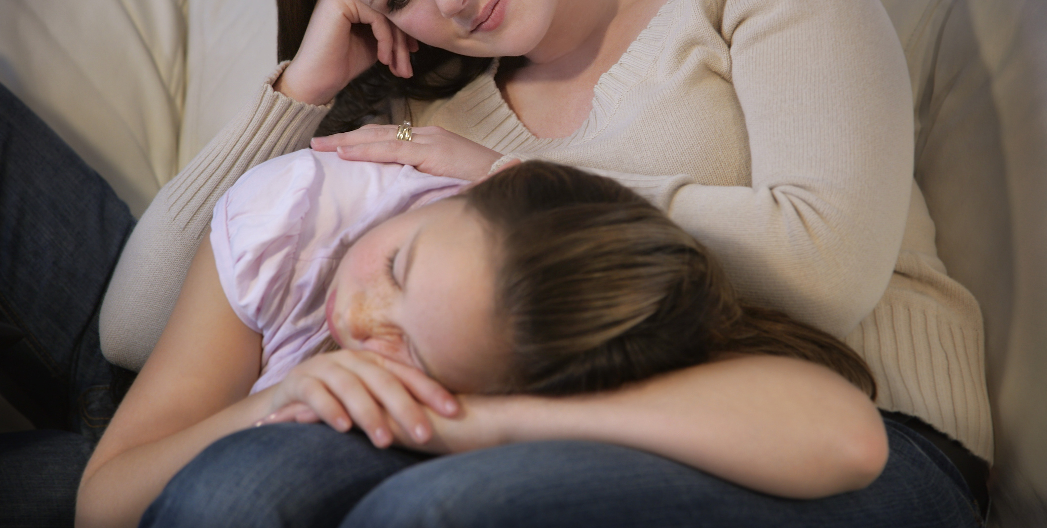 Mother watches tenderly over daughter