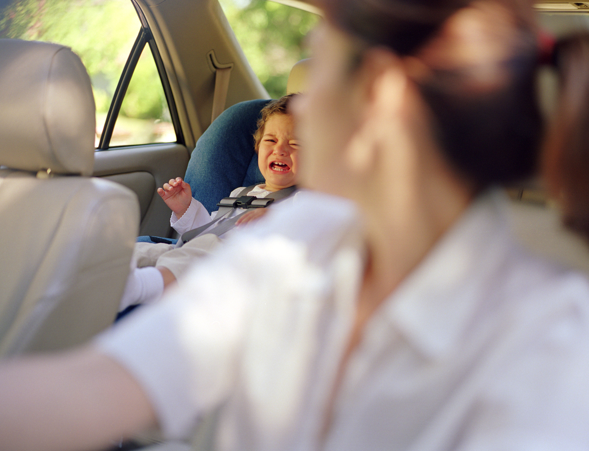 Mother and son in car with seatbelts