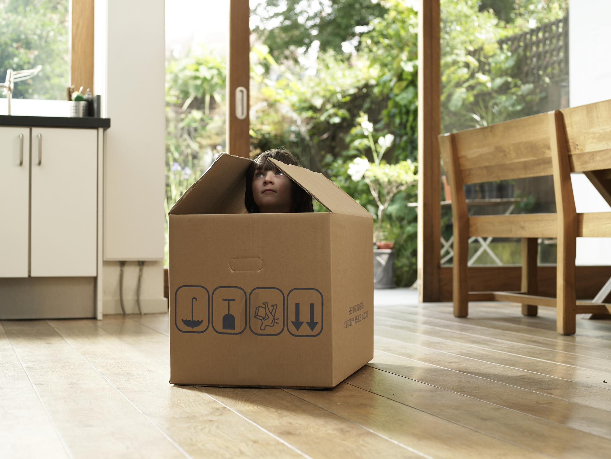 Child in cardboard box