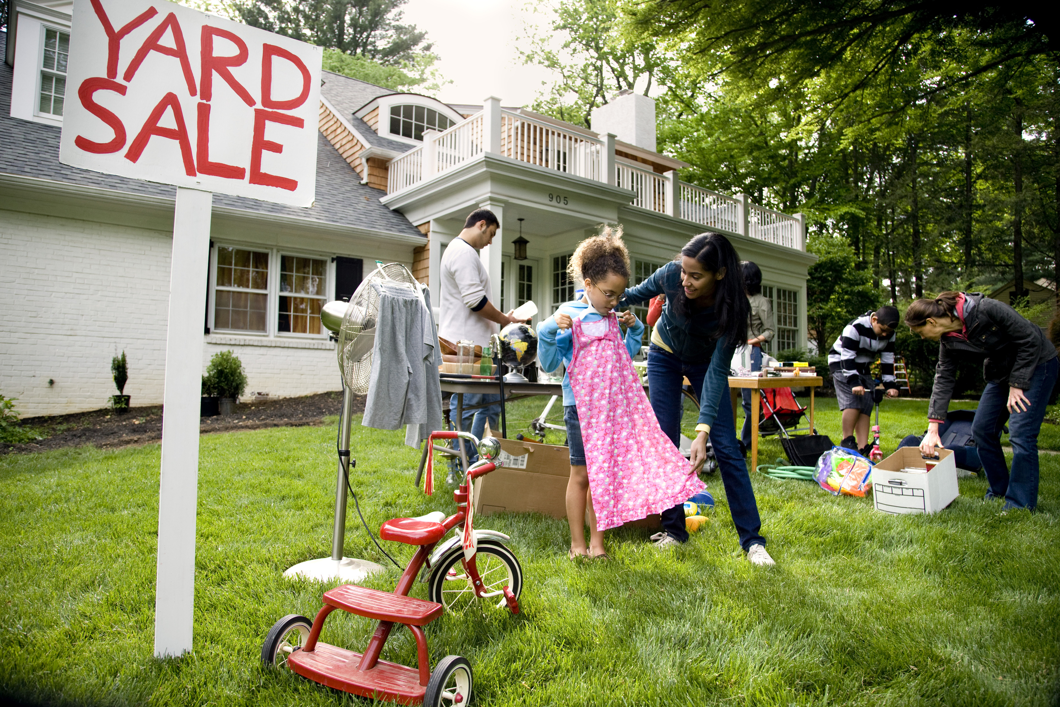 Wide view of suburban yard sale