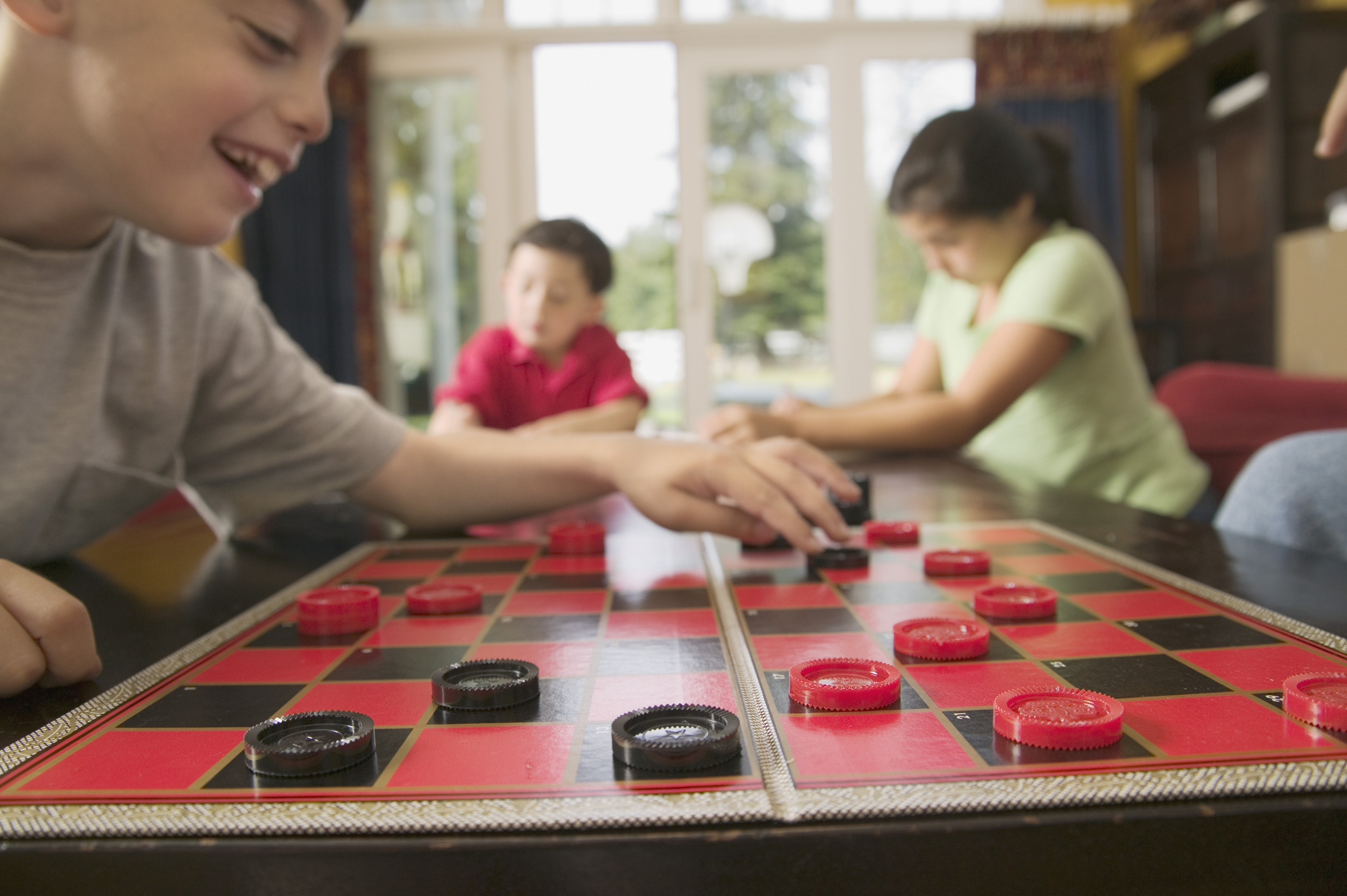 High angle view of children playing checkers