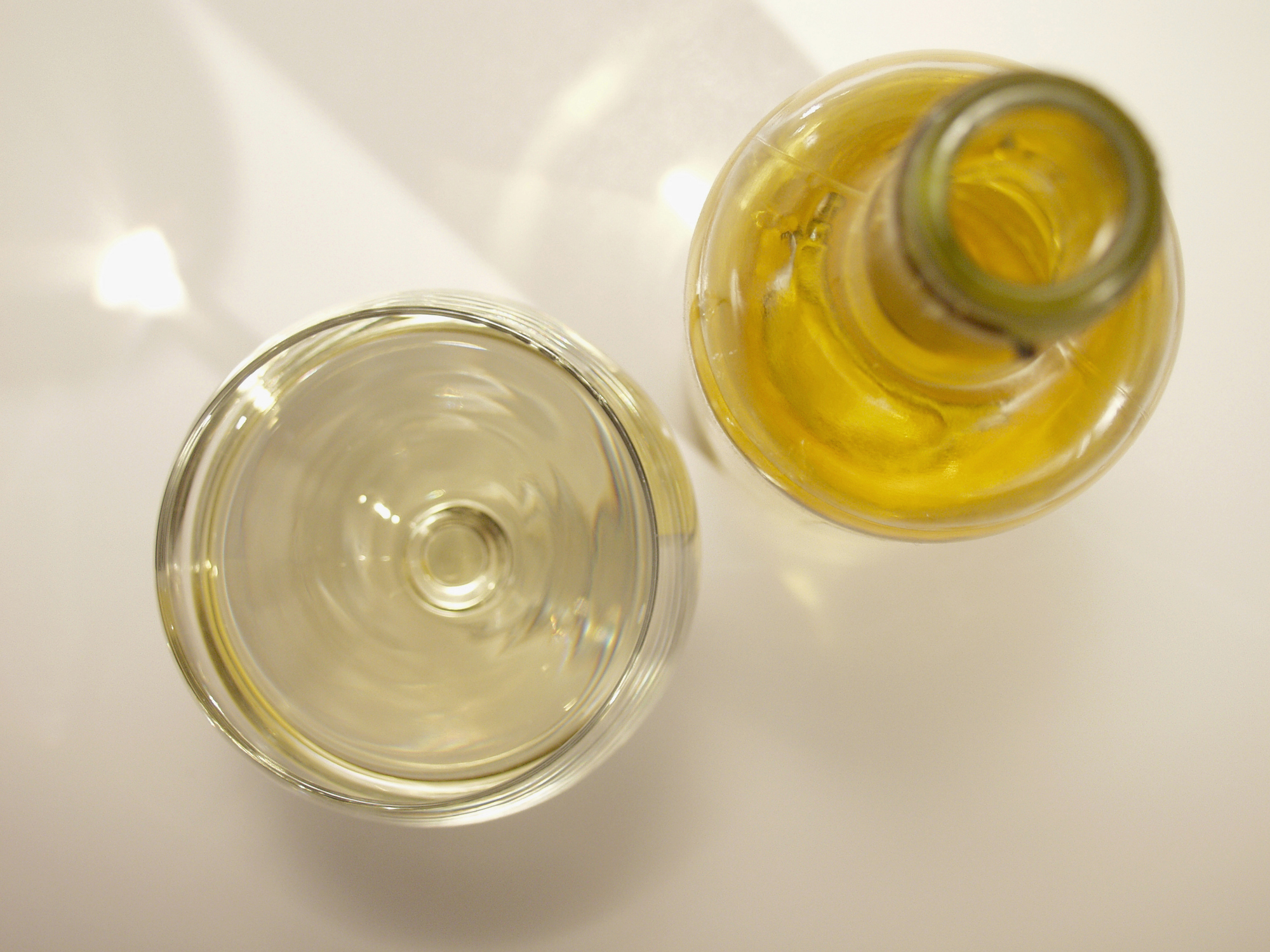 High angle view of a bottle and a glass of alcohol