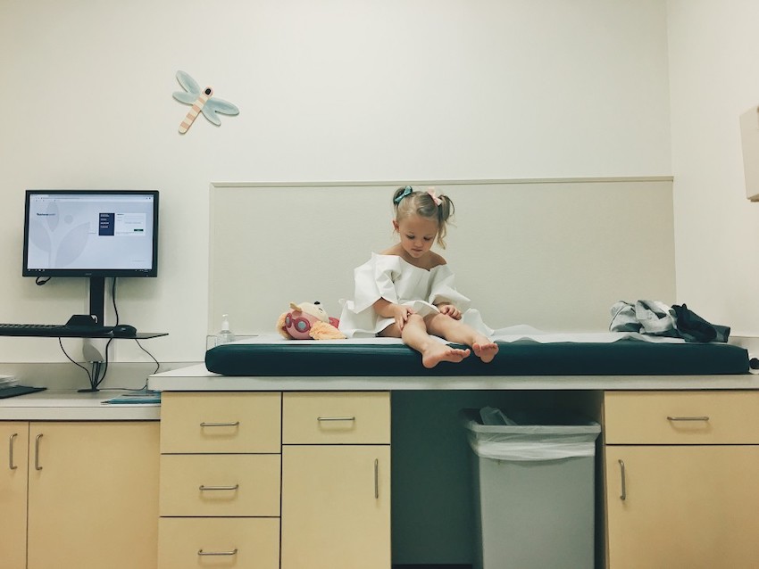 a-little-girl-waits-to-get-a-checkup-from-her-pediatrician-in-the-exam-room-of-a-doctor-s-office_t20_OzXPXL.jpg