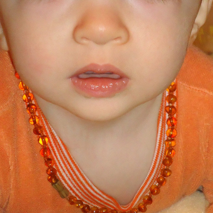 baby-wearing-amber-teething-necklace.jpg