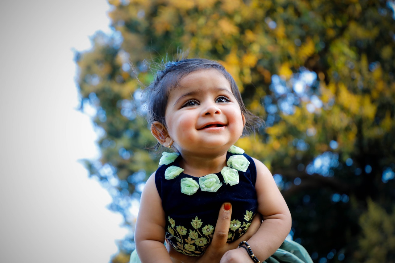 close-up-photo-of-baby-wearing-floral-dress-2568876.jpg