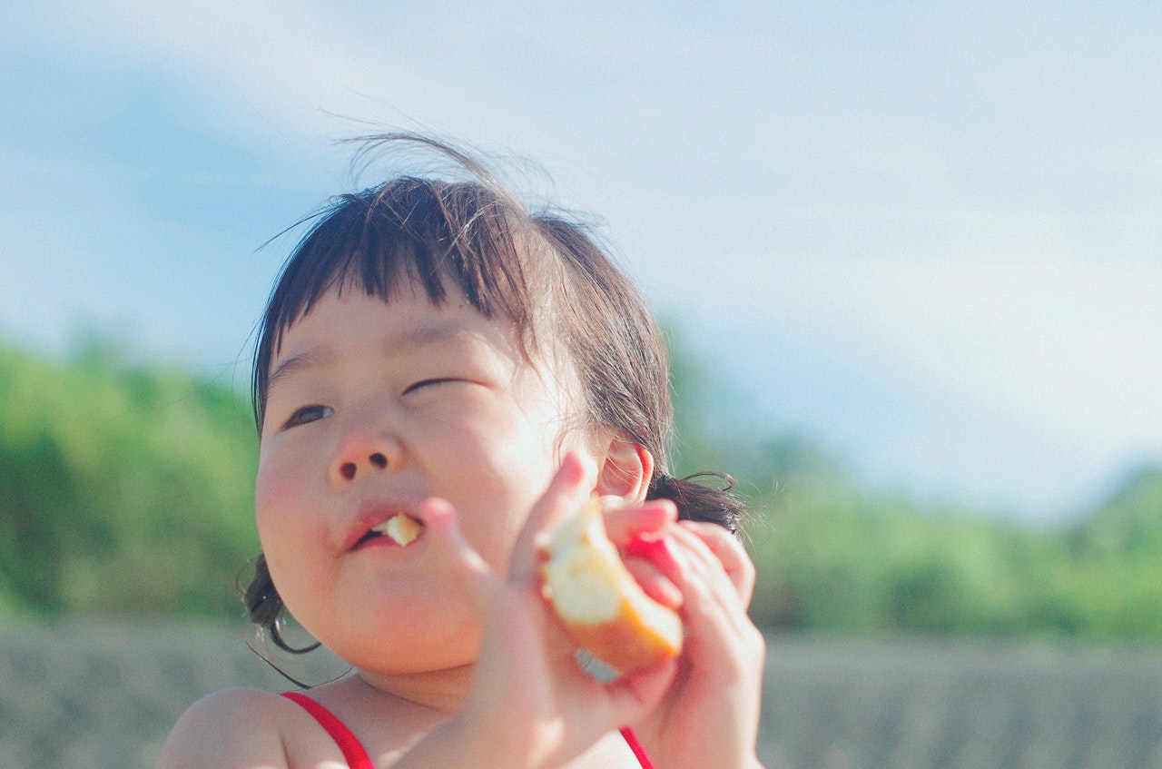 close-up-photography-of-a-girl-eating-bread-2800533.jpg