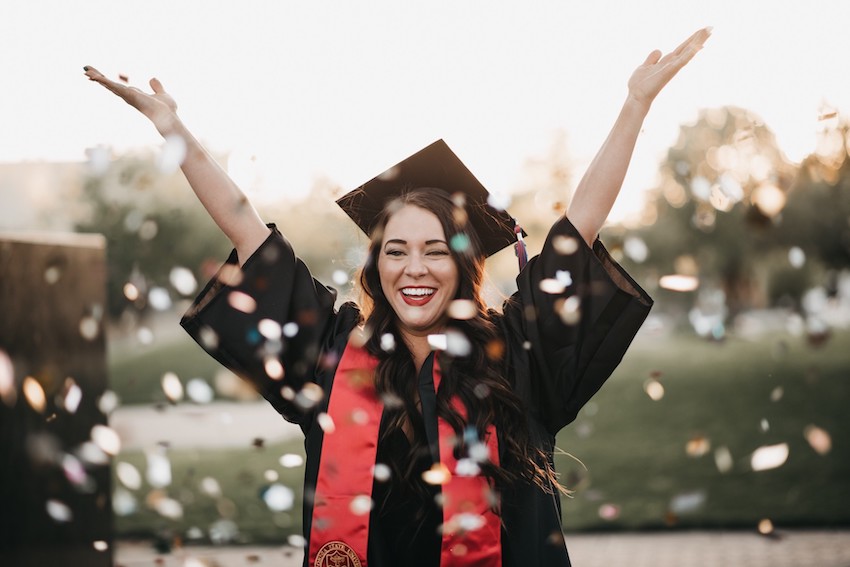 college-graduate-throwing-confetti-in-the-air_t20_6lNQYO.jpg