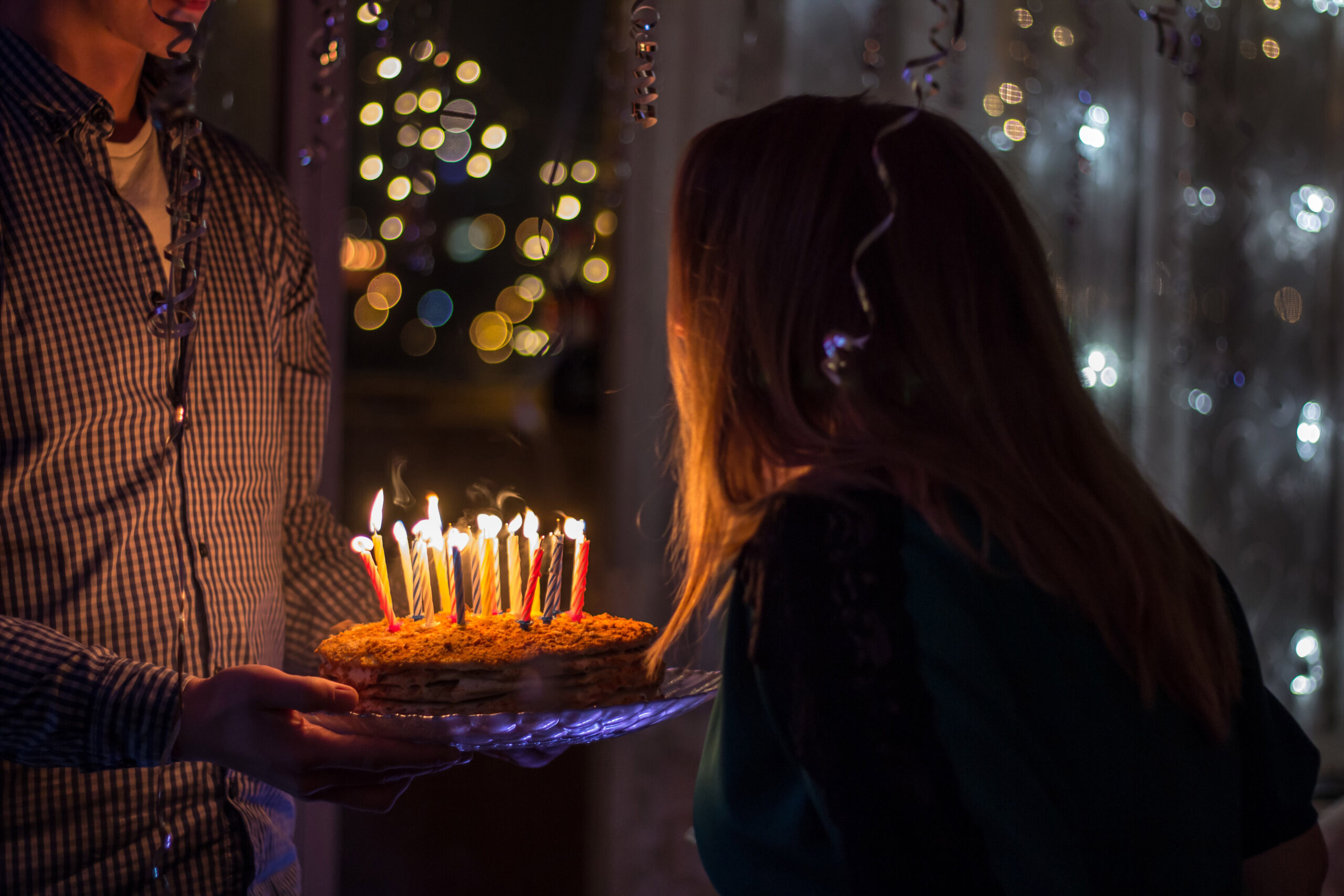 girl-blowing-out-birthday-candles.jpg