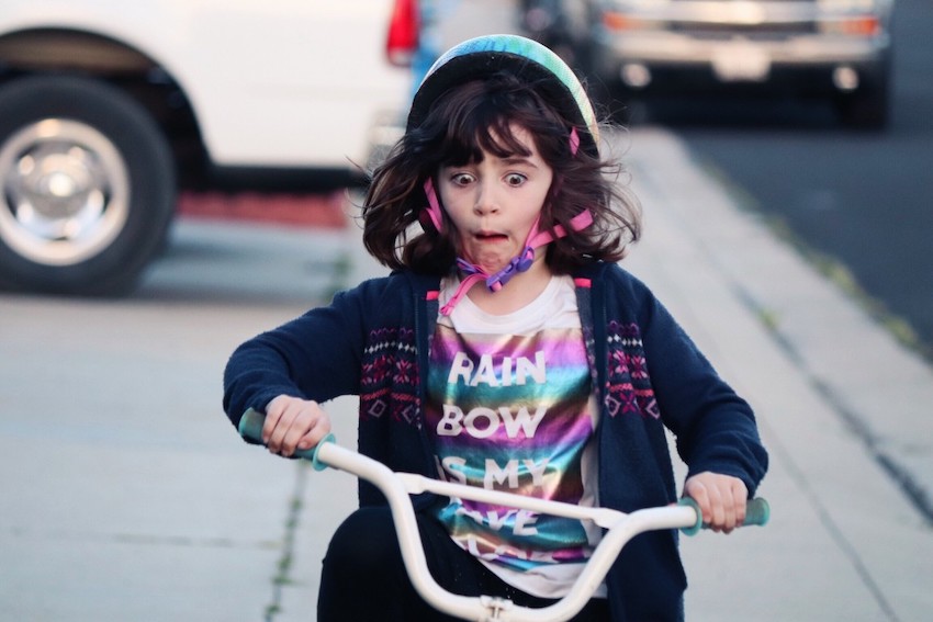 girl-riding-bike-on-sidewalk_t20_LOn03Y.jpg