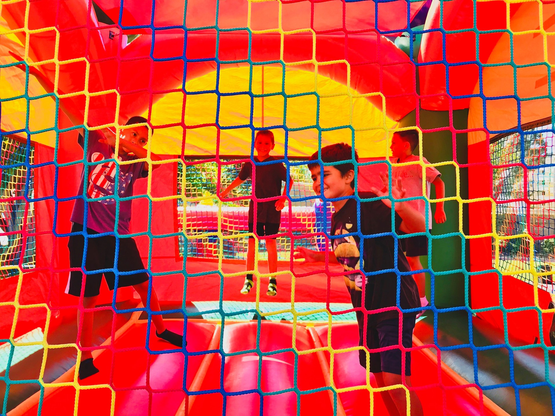 happy-kids-jumping-and-having-fun-in-a-big-bright-colorful-bounce-house_t20_WxklN1.jpg