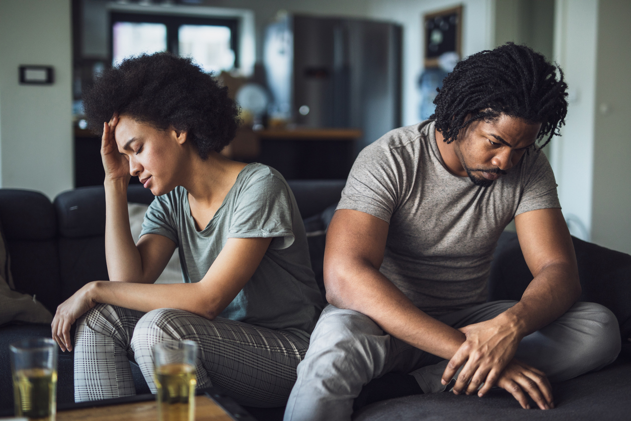 African American couple having problems in their relationship at home.