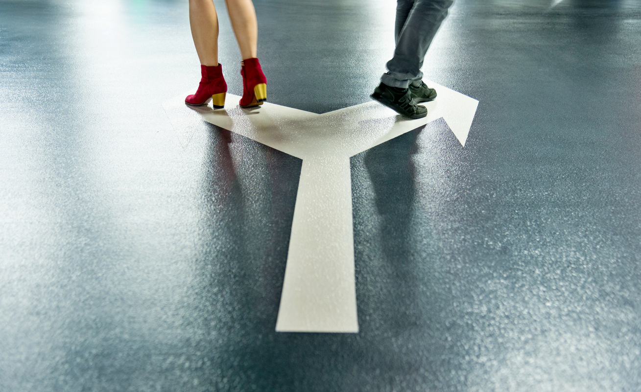 Man and woman walking on different directions