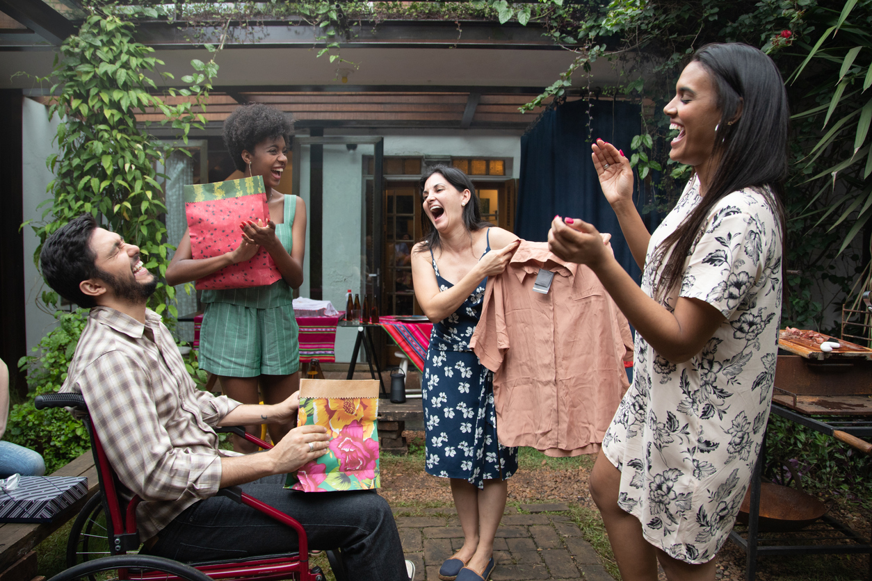 Friends Exchanging Presents at get-together barbecue party