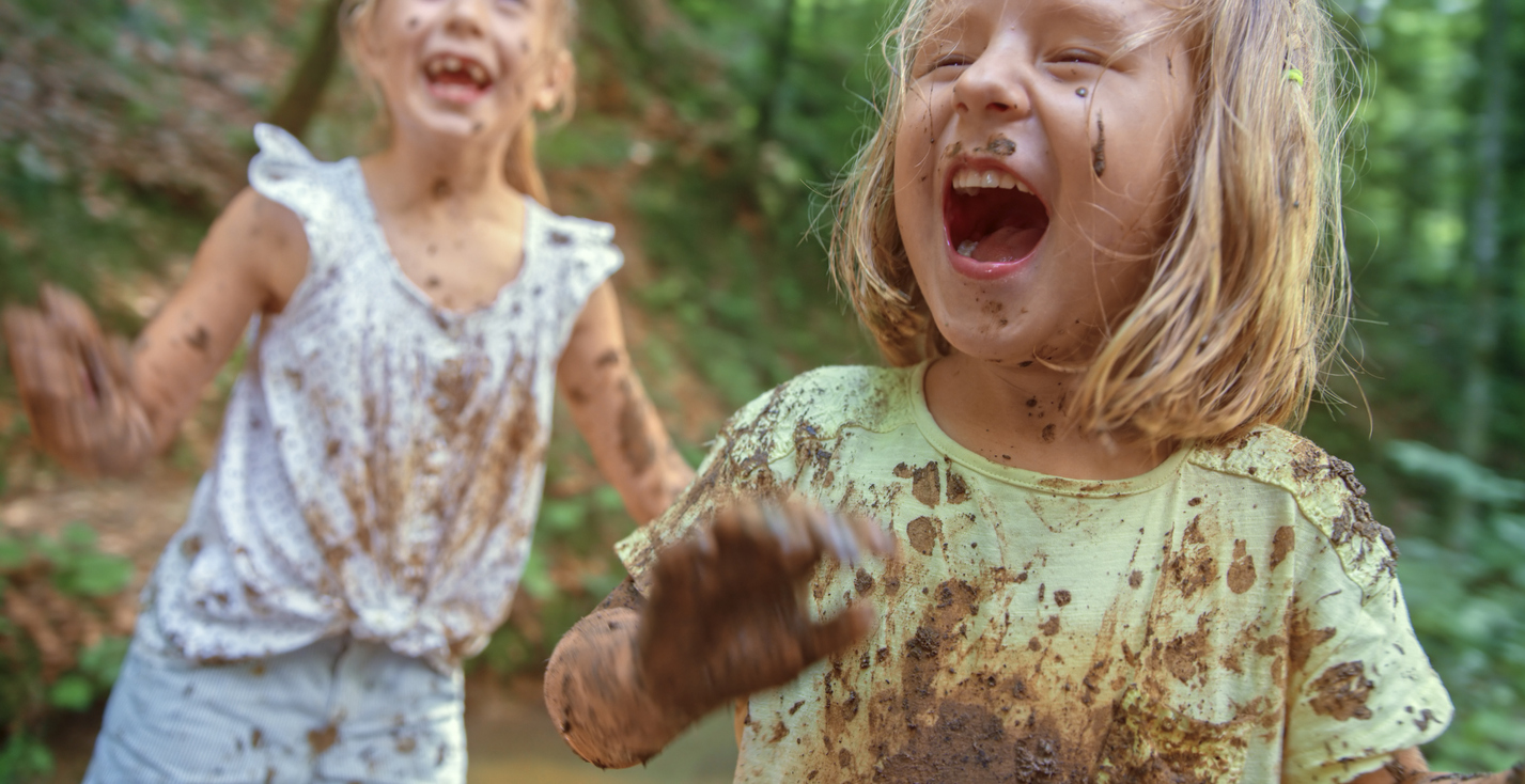 Girls playing in mud