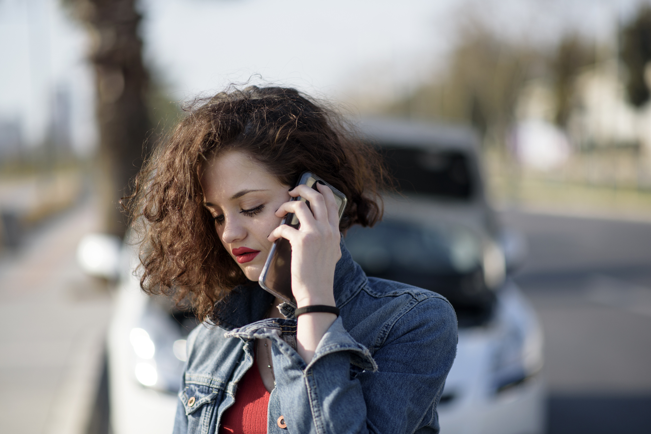 Unhappy woman with a broken car