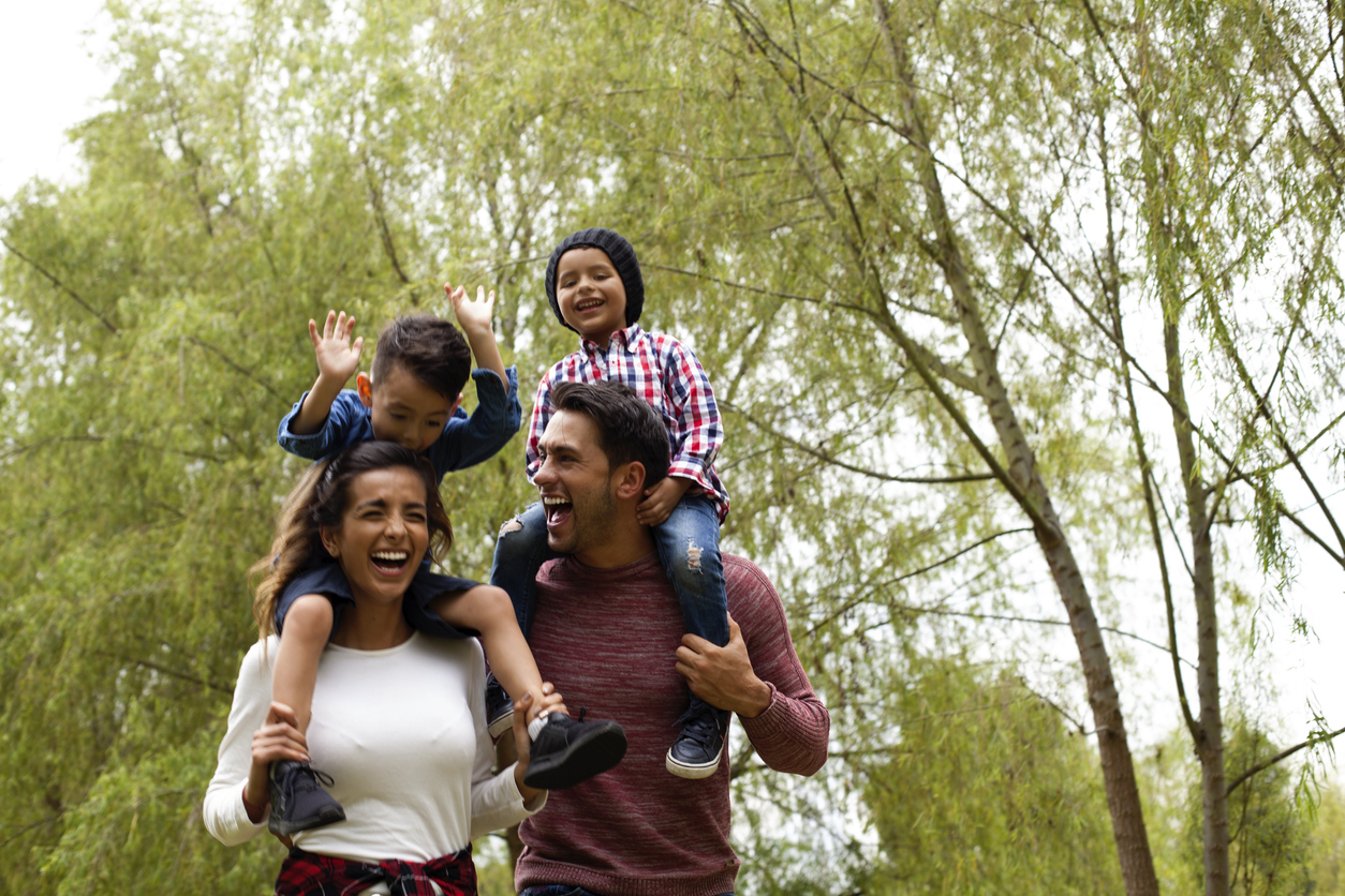 Family has fun playing in the field