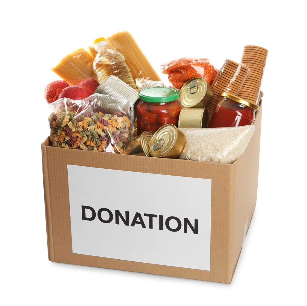 Donation box full of different products on white background