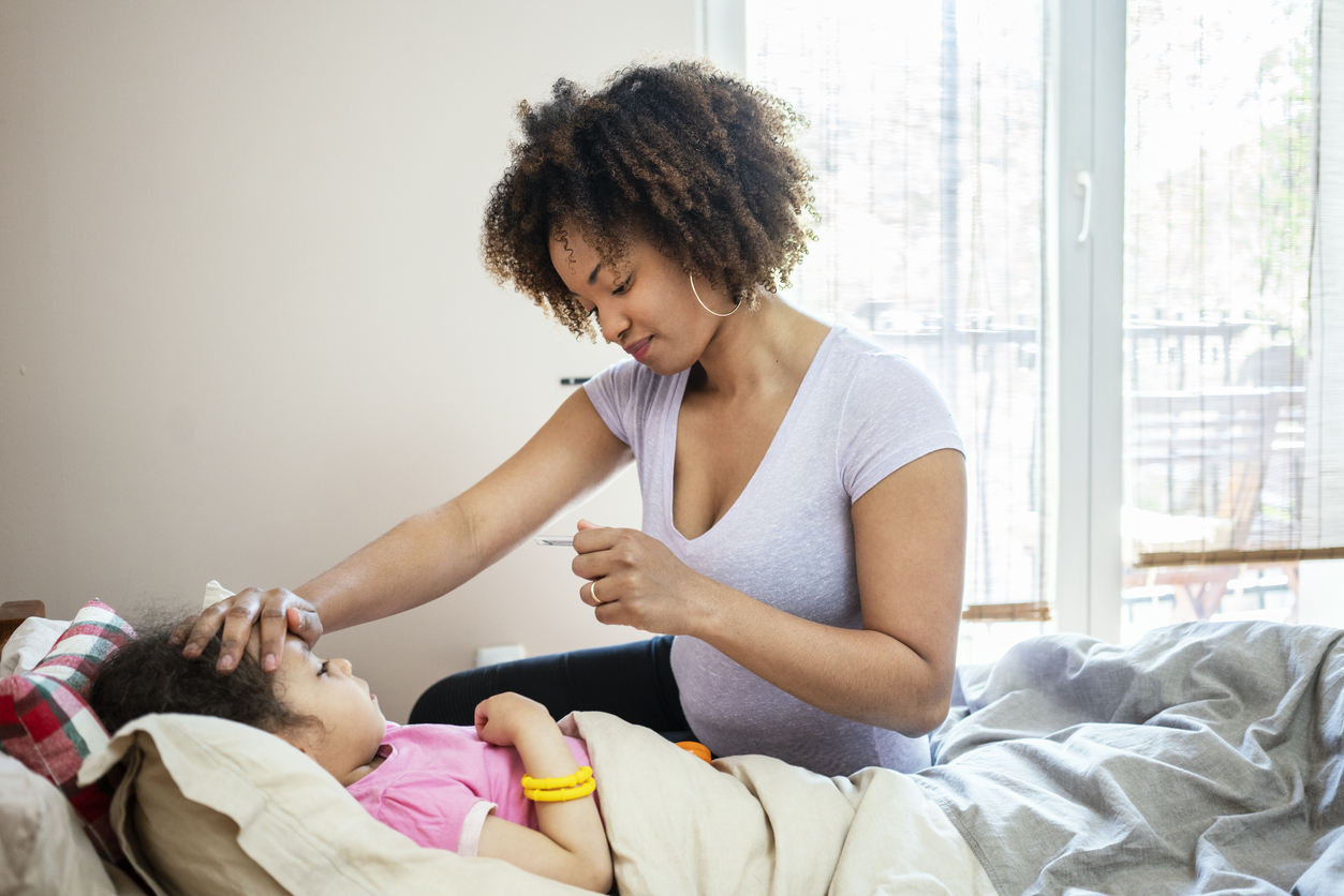 Mother taking care on her sick daughter