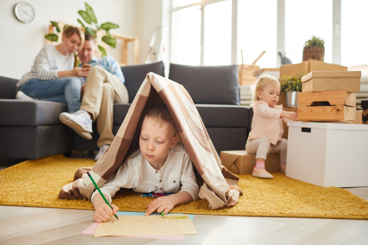 Boy drawing new house for his family