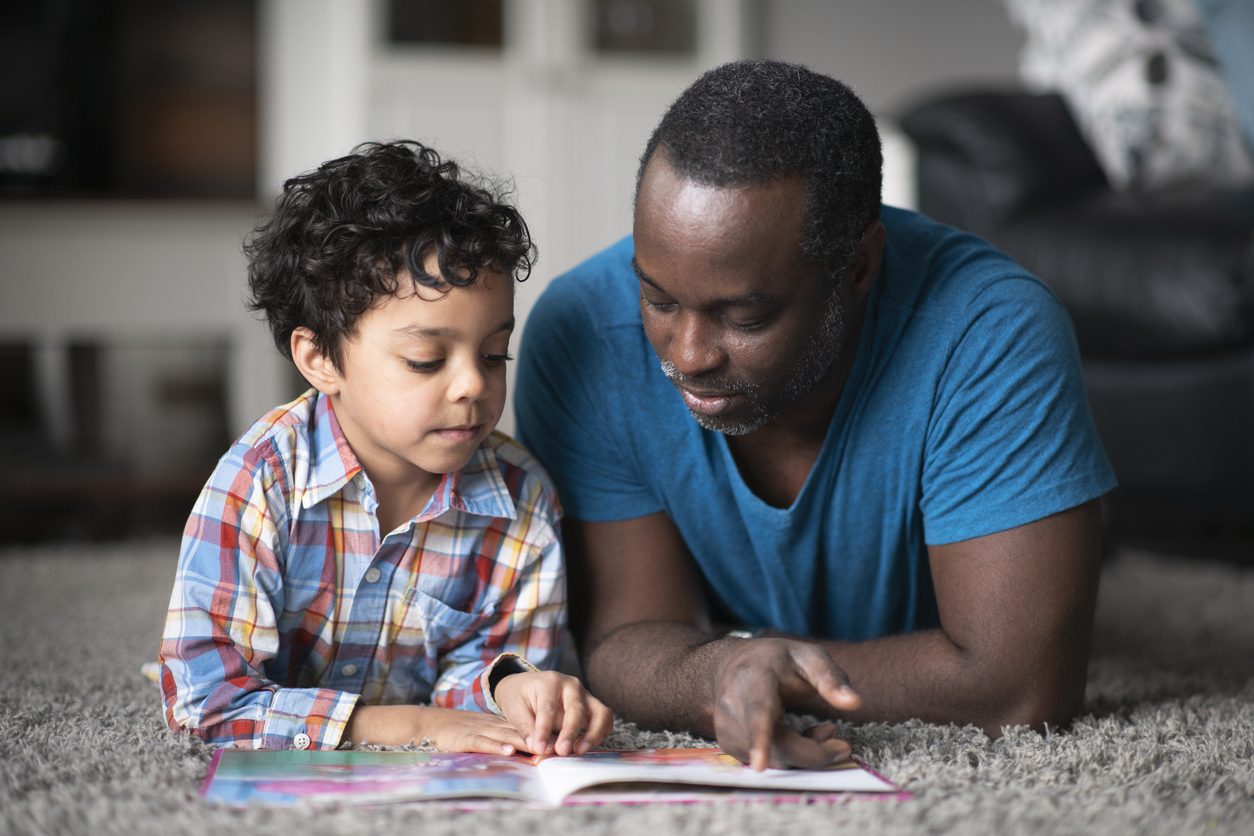 Father reading to son