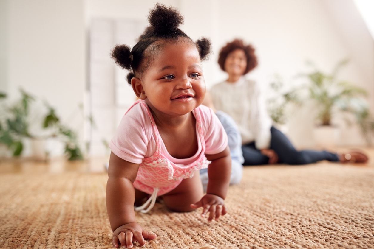 Two Mothers Meeting For Play Date With Babies At Home In Loft Apartment