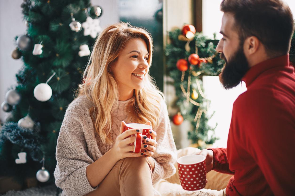 Couple drinking coffee together during Christmas holidays