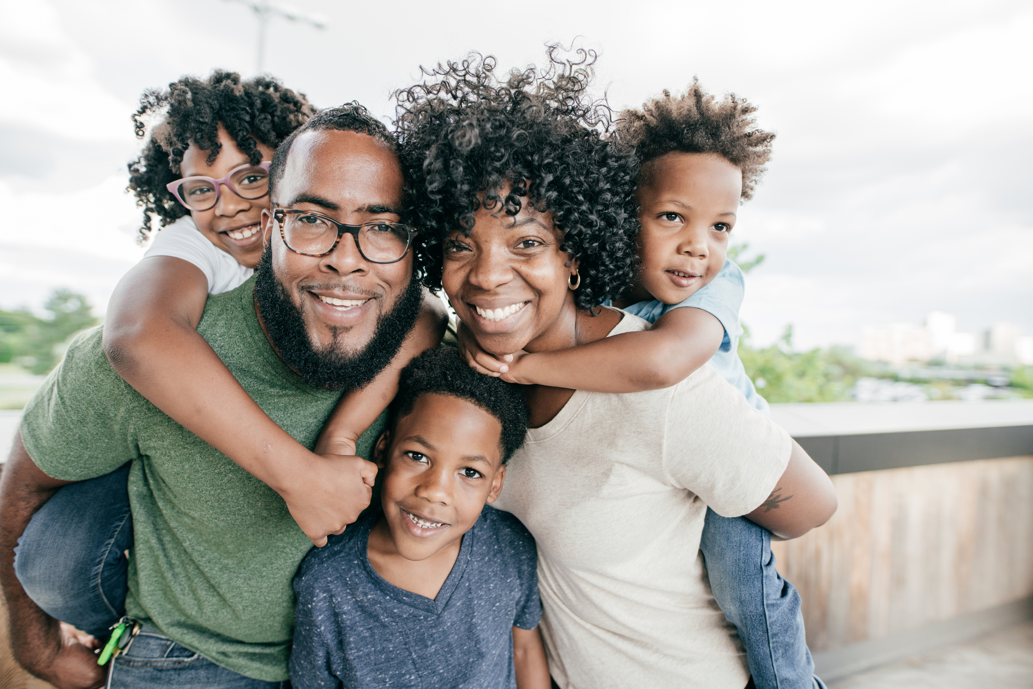 Happy family looking at camera