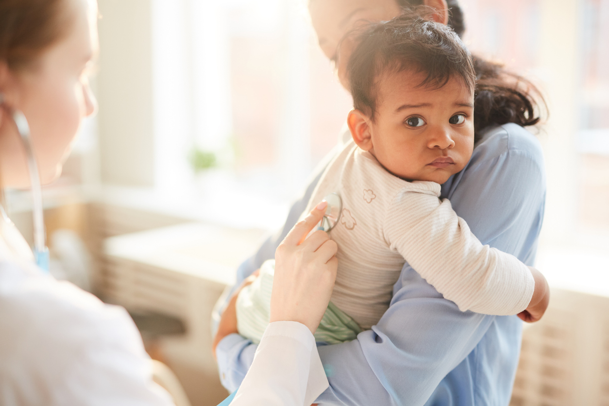 Doctor examining the child