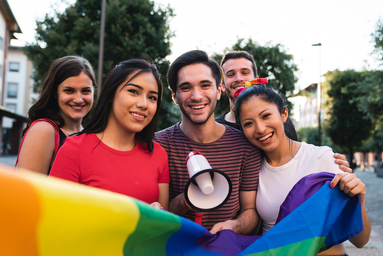 Five friends together at an LGBTQI Pride event