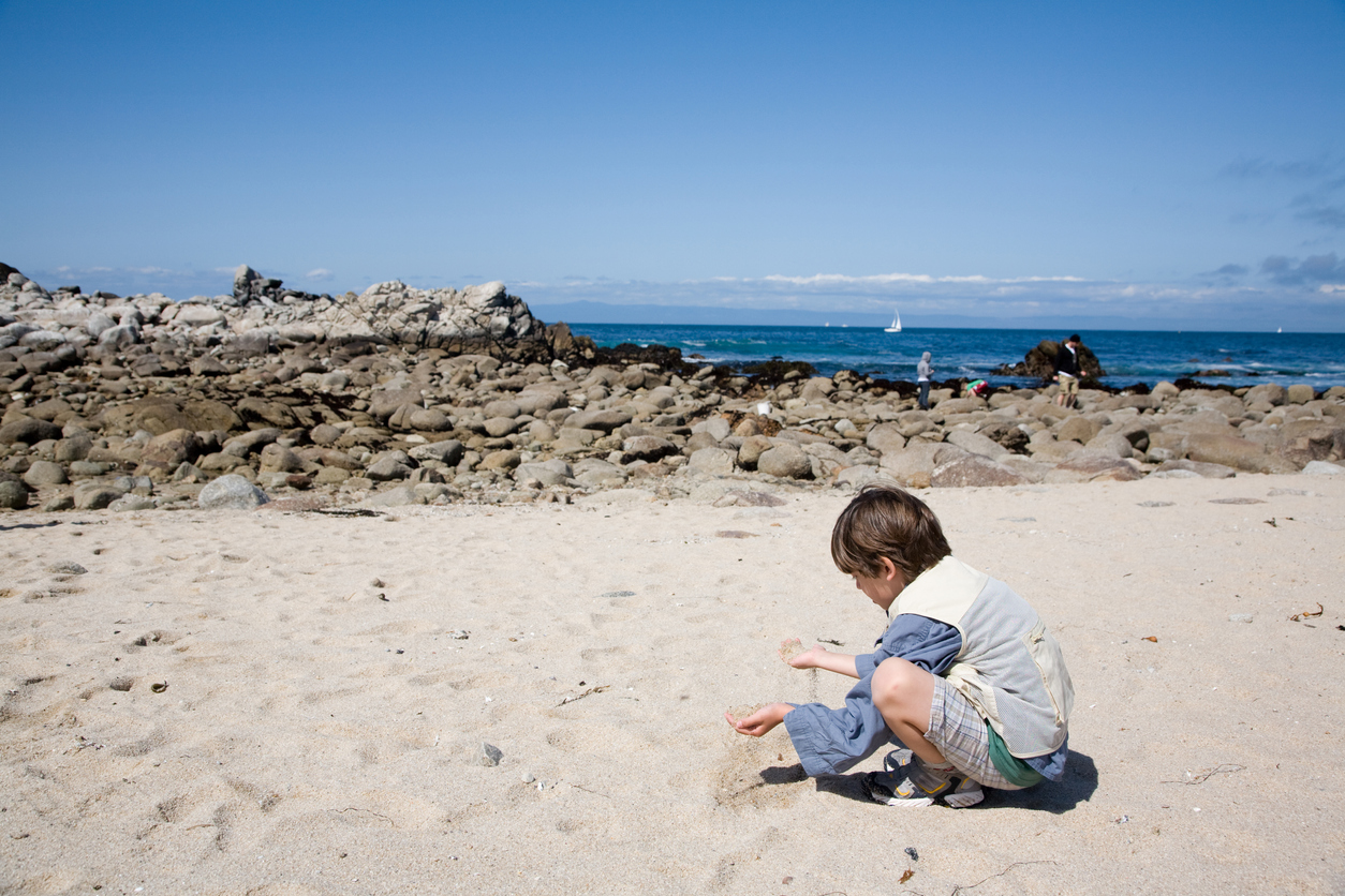 Boy Playing on the beach