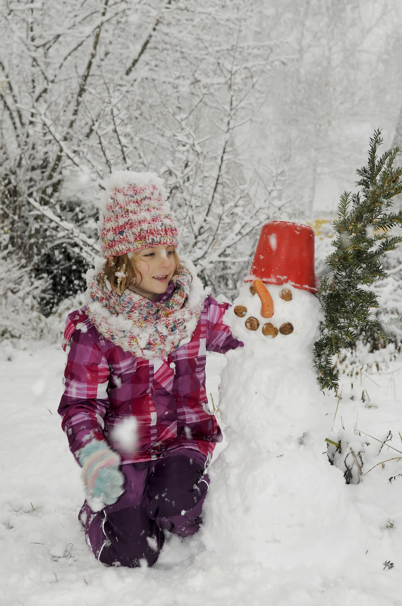 little girl with snowman