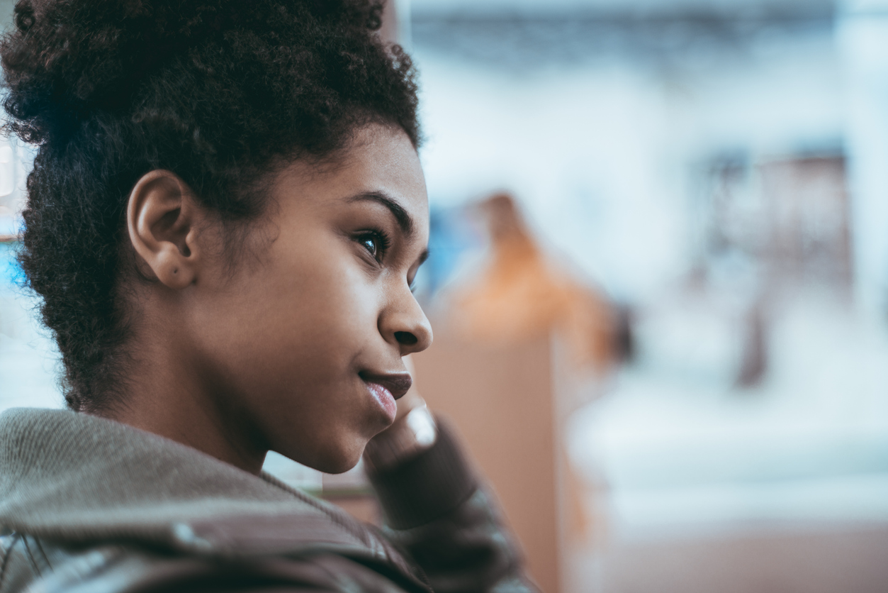 Young black female is looking aside, portrait