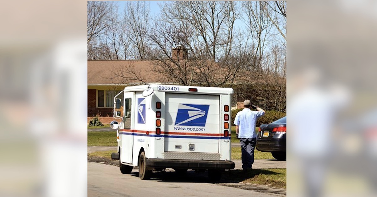 mailman-salutes-flag