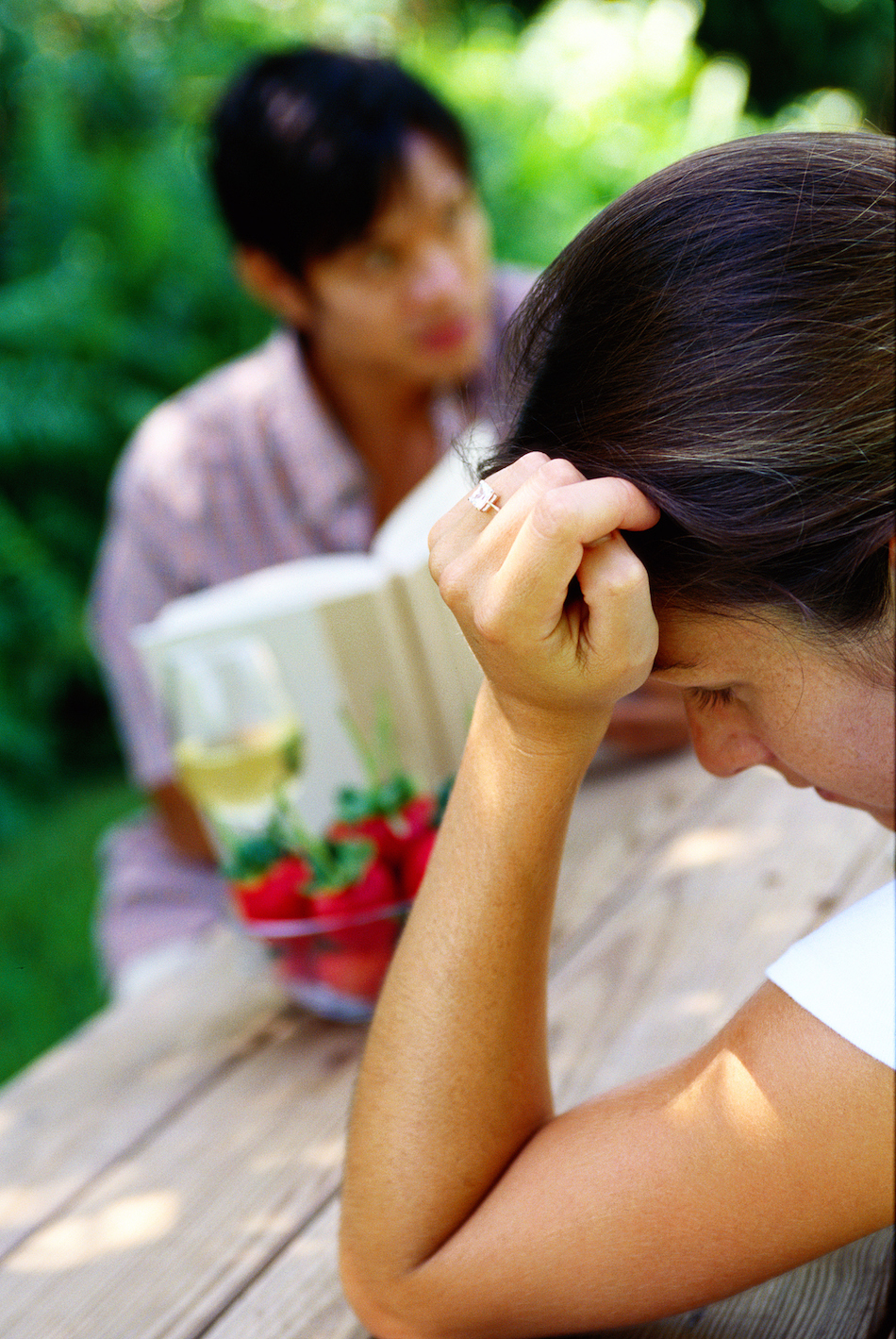 view of a young couple sitting on a table