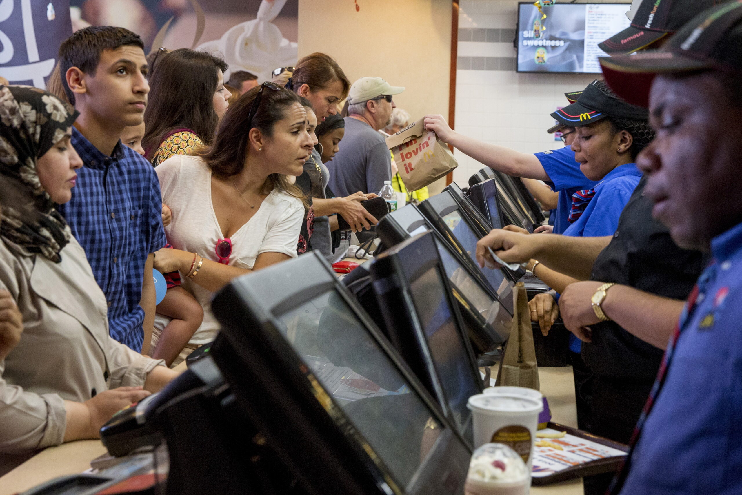 CUSTOMERS ARE SERVED AT A MCDONALD'S IN TIMES SQUARE IN NEW YORK