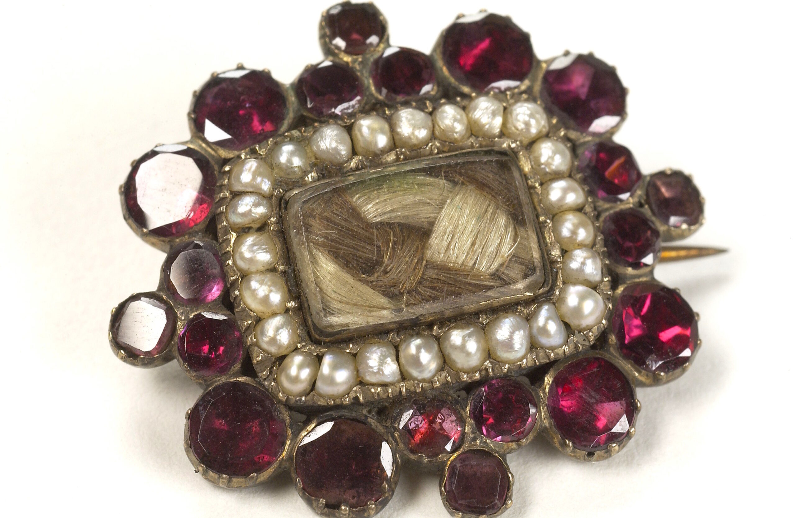 L0036419 Mourning brooch containing the hair of a deceased relative.