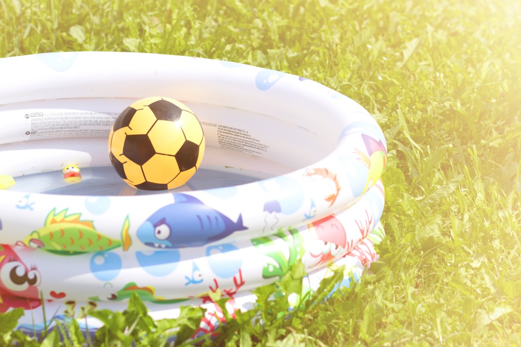 nominated-ball-in-the-childrens-inflatable-pool-on-the-green-grass-in-sunny-weather-water-pool_t20_Op4lvO.jpg