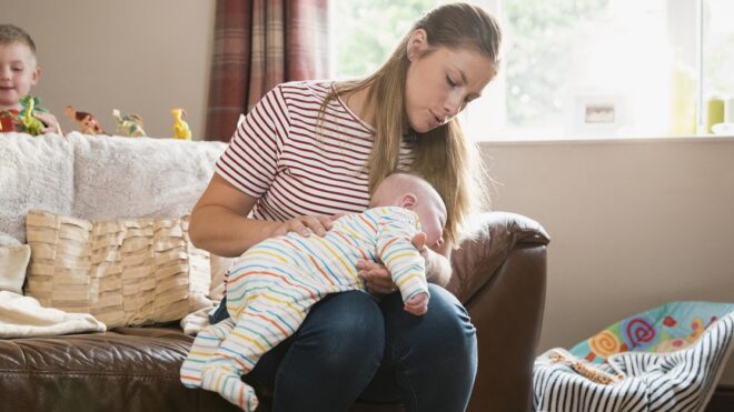 Mother Burping Her Baby Boy