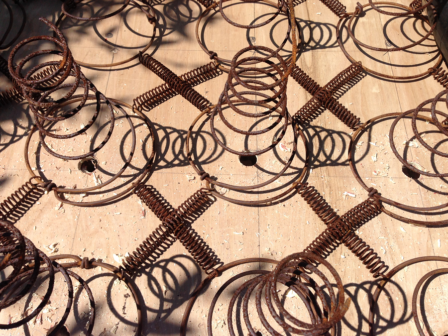 rusty-bedspring-light-socket-holes-in-place.png