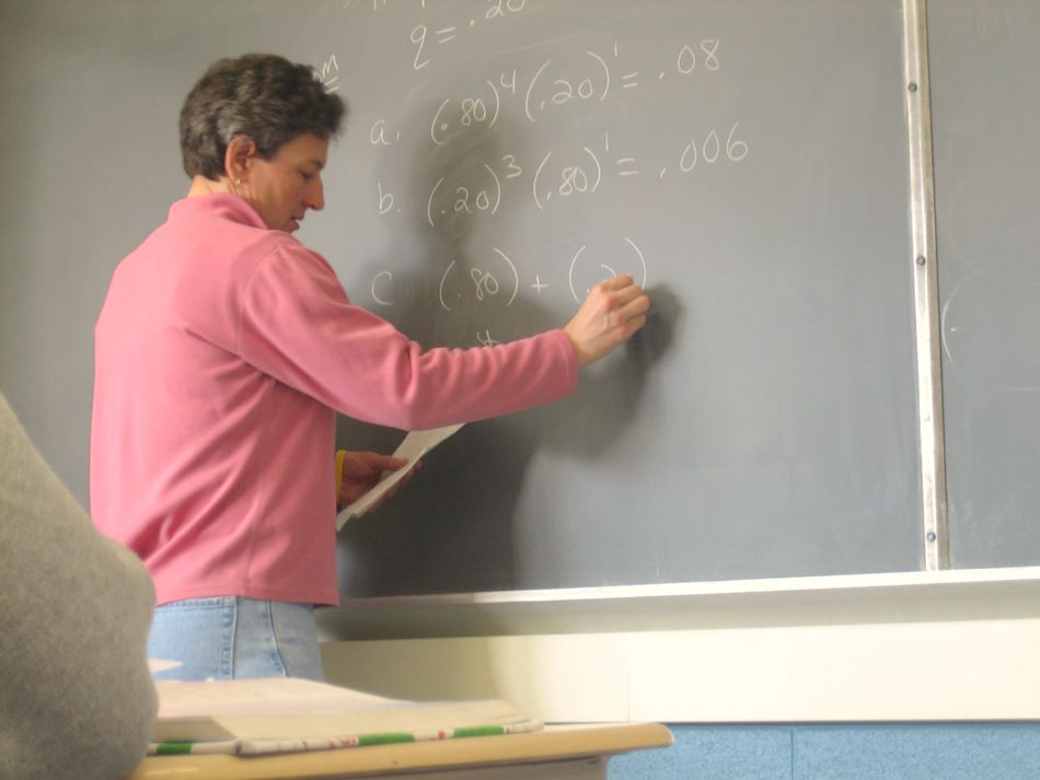 teacher-writing-on-blackboard.jpg