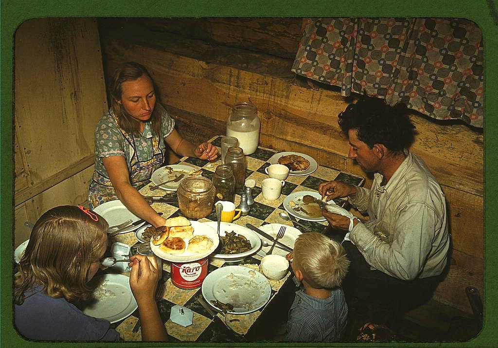 the-caudill-family-eating-dinner-in-their-dugout-in-pie-town-new-mexico-in-late-1940.jpg