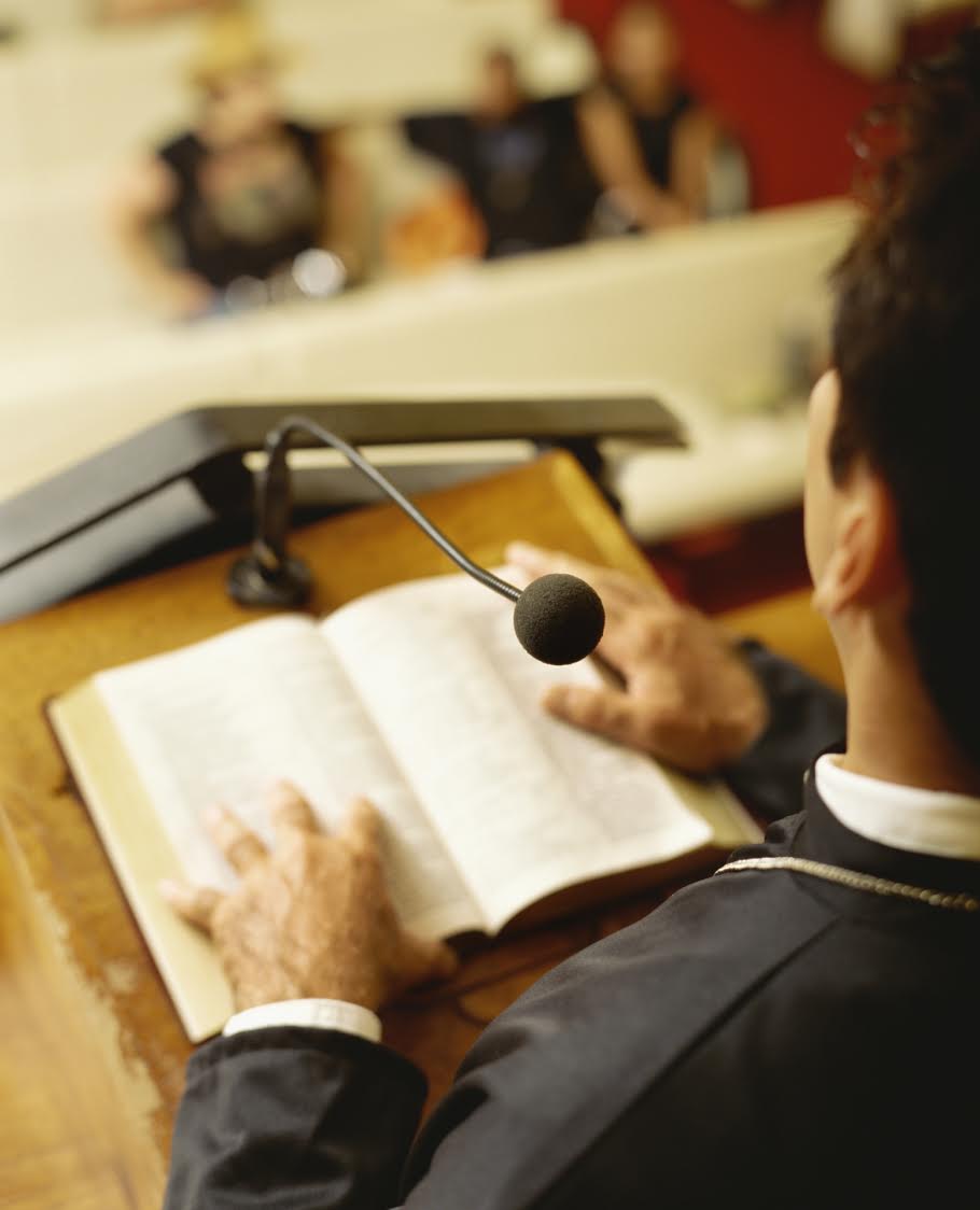 high angle view of a priest delivering a sermon in church