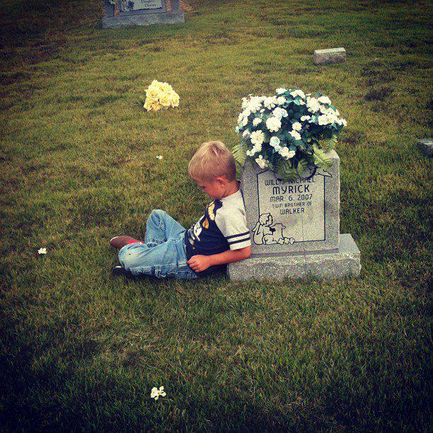 walker-leaning-on-grave.jpg