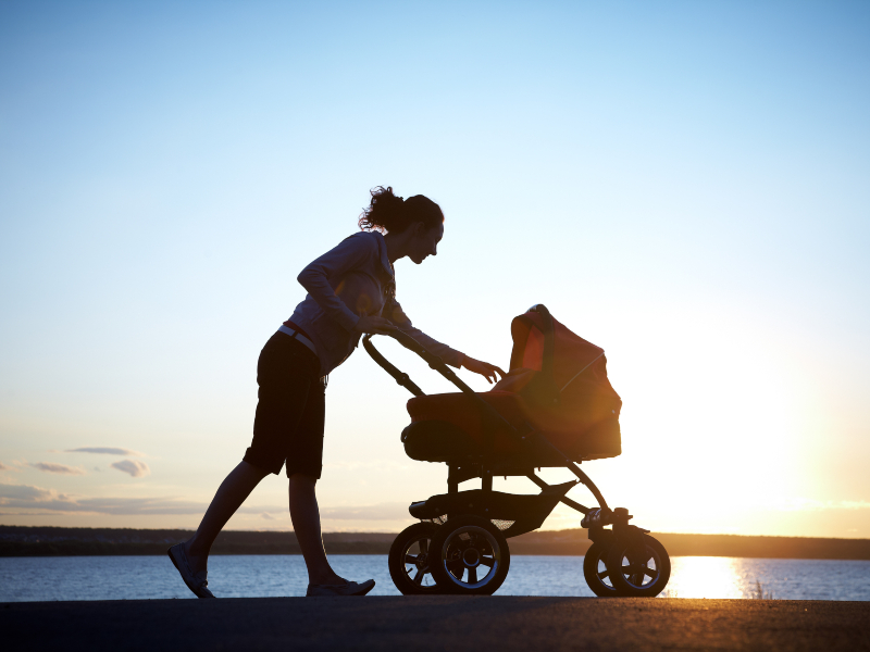 Silhouette of  young mother enjoying motherhood